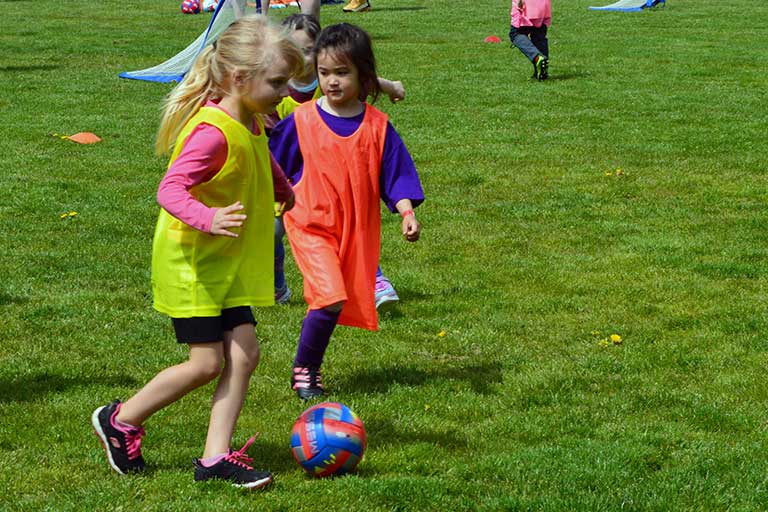 two-girls-playing-soccer-2022-micro-clinic